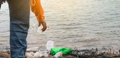 Collecting waste on beach