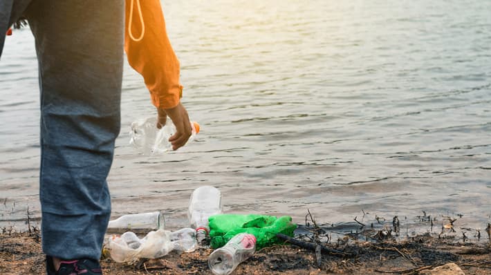 Collecting waste on beach
