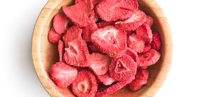 wood bowl containing freeze-dried fruit