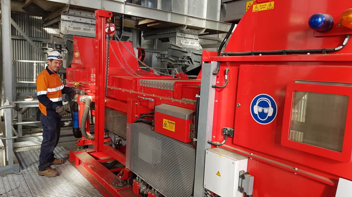 Man standing next to a TOMRA COM Tertiary sorter