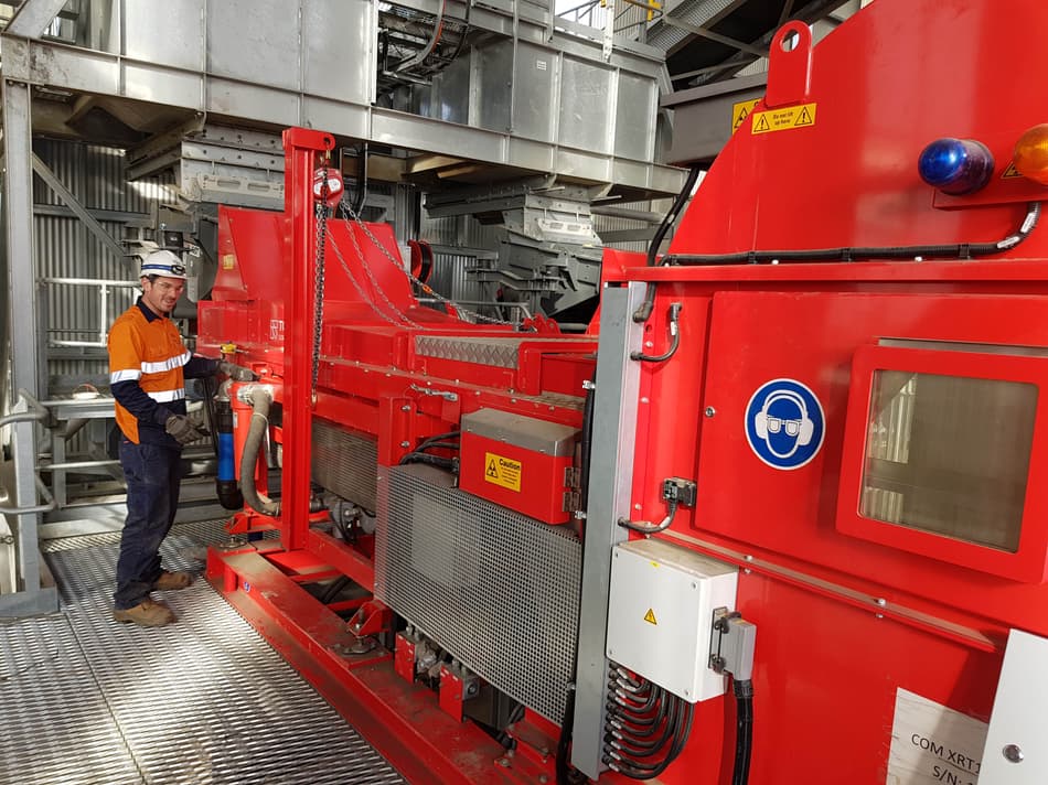 Man standing next to a TOMRA COM Tertiary sorter