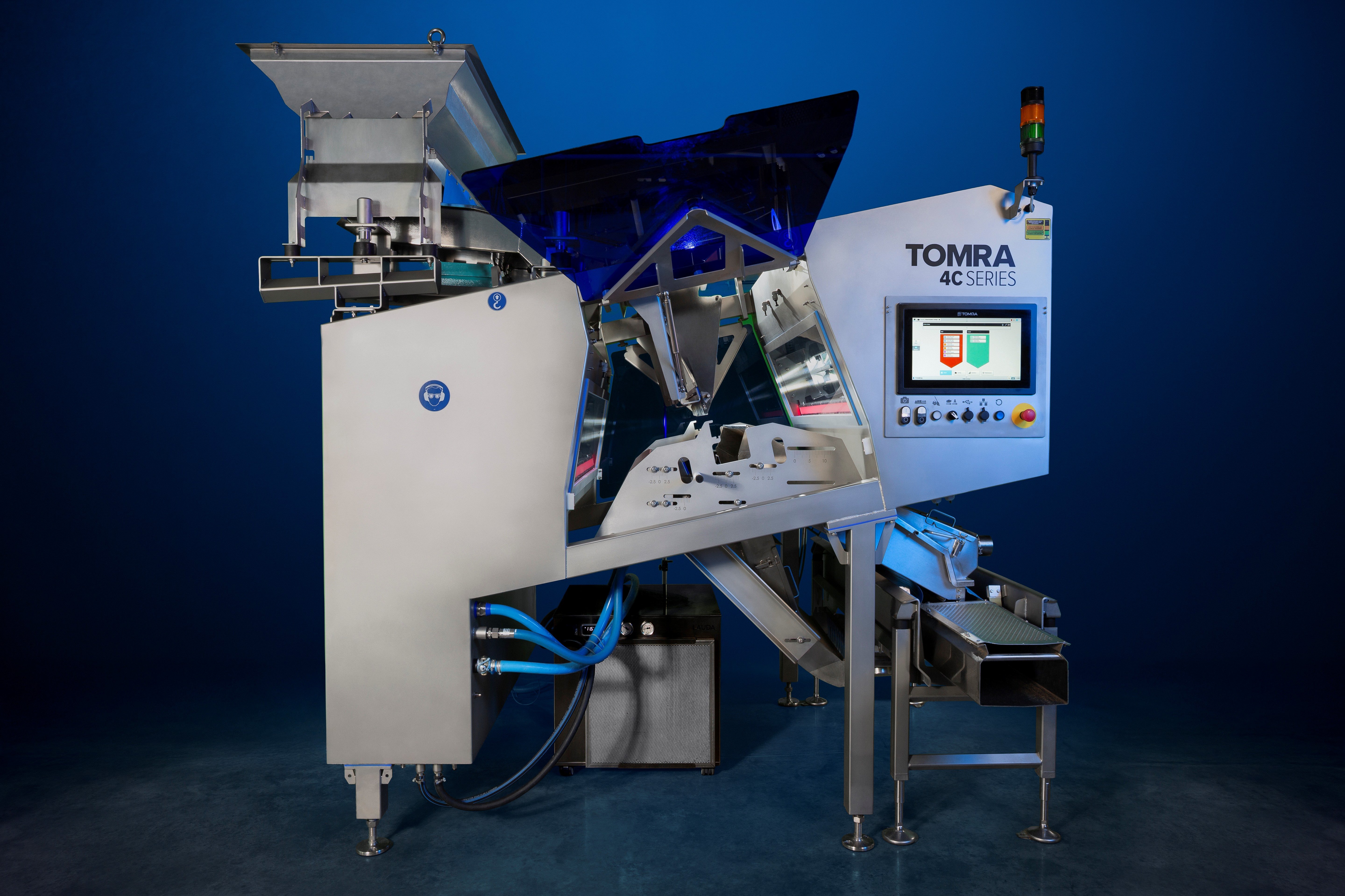 An image of the TOMRA 4C optical sorting machine on a dark background