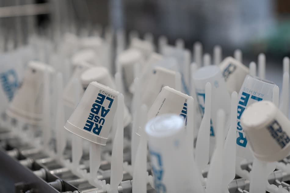 empty cups ready for washing at REUSEABLE sanitization hub 