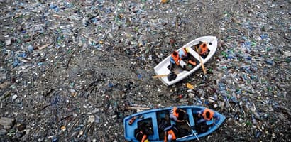 Boat in plastic pollution 