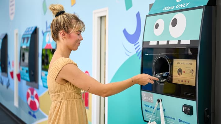 Consumer returns bottle in Australia container deposit scheme 