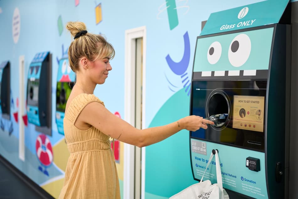 Consumer returns bottle in Australia container deposit scheme 