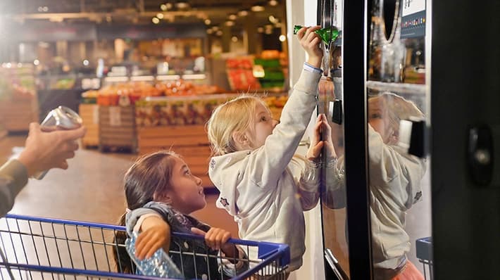 Image of consumers returning containers