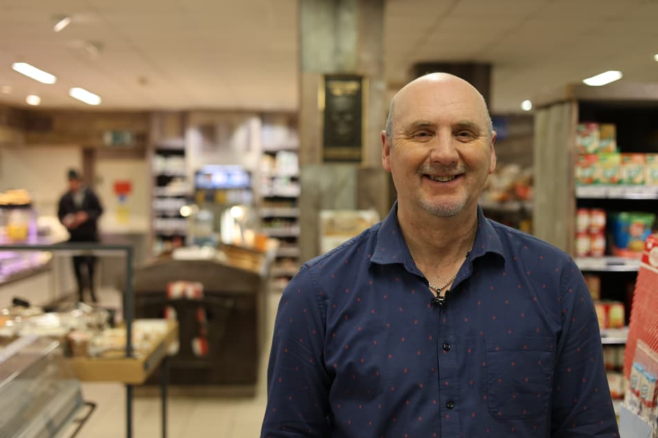 Smiley man in a supermarket
