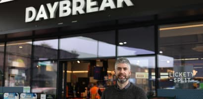White man in front of a Daybreak store