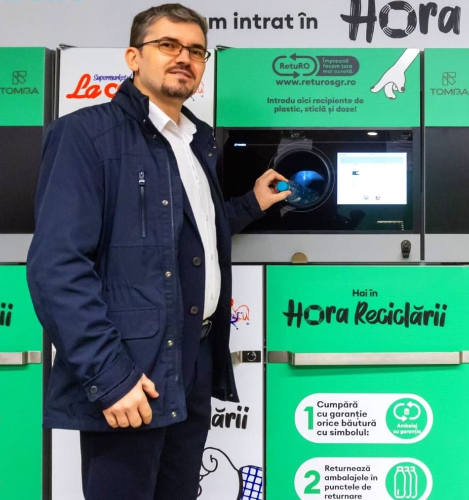 Man and reverse vending machine