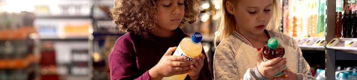 Girls looking at bottles in store
