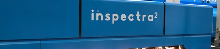 An image of the Inspectra2 internal grading system overlooking four lines of apples running on carriers