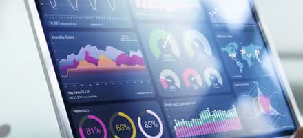 Laptop with statistics and graphs