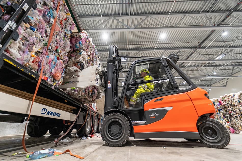 Bales of mixed plastic waste being delivered to Områ plastic sorting facility 