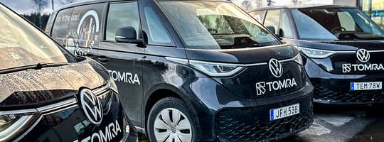 Electric service vehicles parked side by side