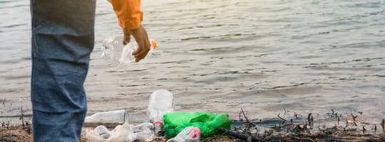 Picking up containers on beach