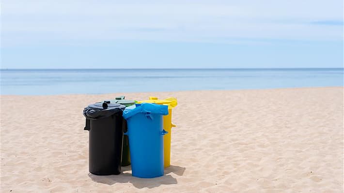 plastic bins on beach