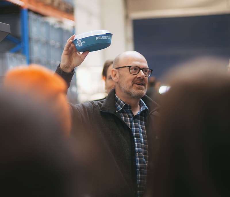Man holding a REUSEABLE food bowl