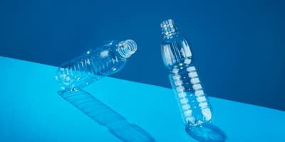 Empty bottles on blue background