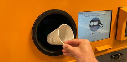 Reusable cup being returned in a specially designed TOMRA RVM