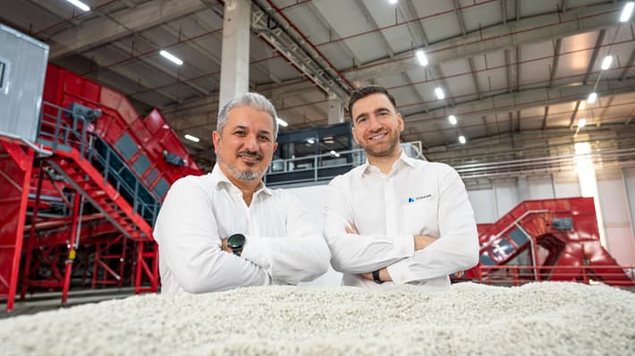 Two men with their arms crossed