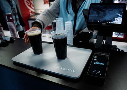 TOMRA Reuse barplate used to activate deposit on reusable cups sold at Intility Arena in Oslo