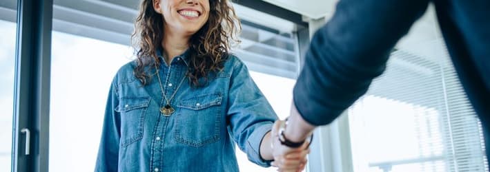 Woman and man shaking hands