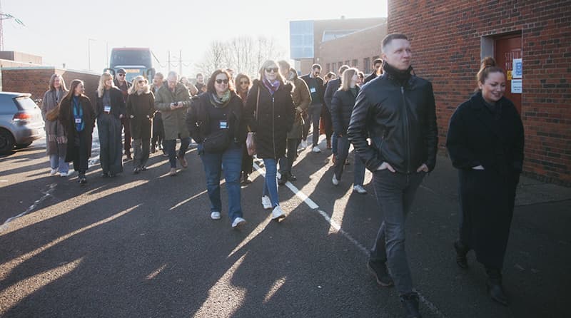 Delegation of people arriving at venue