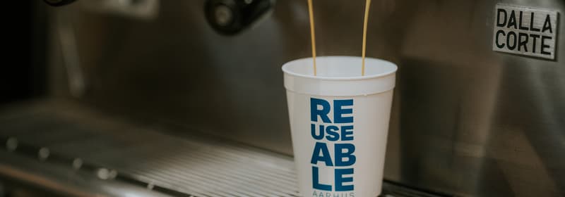 coffee being brewed into a reusable cup