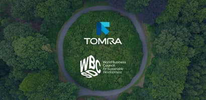TOMRA and WBCSD logos against an overhead view of trees